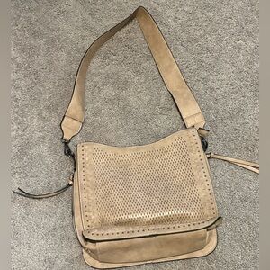 Tan leather conceal carry purse.